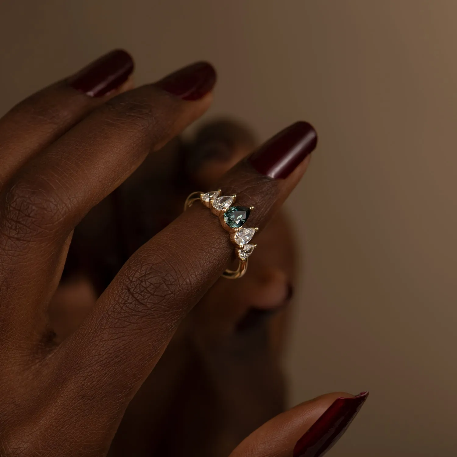 Unique Engagement ring with a Pear Cut Teal Sapphire and Diamonds