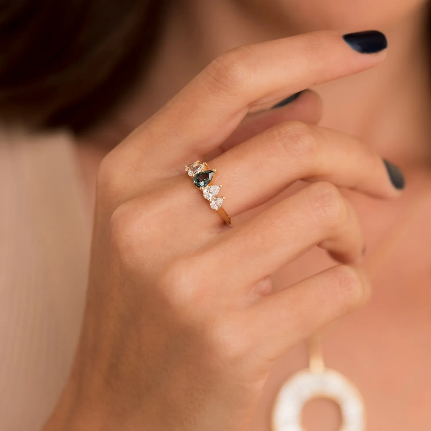 Unique Engagement ring with a Pear Cut Teal Sapphire and Diamonds